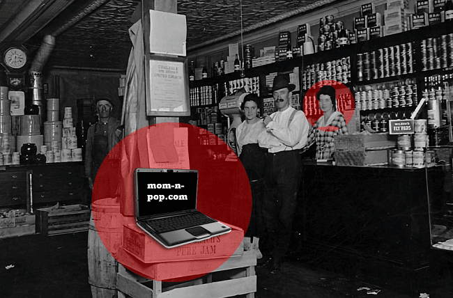 The inside of an old general store with an anachronistic laptop on a box with a screen that says mom-n-pop.com